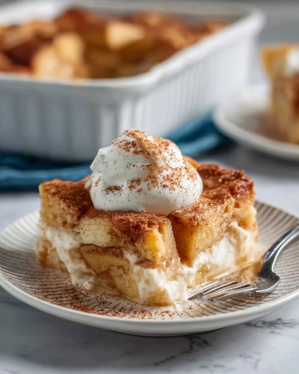 The image shows four round chocolate cookies on a white marbled textured surface with a patterned silver tray underneath. Each cookie has melted dark brown chocolate pools on top with large, soft white marshmallows partly melted into the cookies. Two whole white marshmallows lie on the surface beside the cookies. The cookies' texture looks soft and slightly cracked, showing a rich dark brown color. Photo taken with an iphone --ar 4:5 --v 7